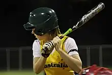 woman holding softball bat