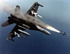 An Australian F-18A Hornet fires an AIM-7 Sparrow missile.