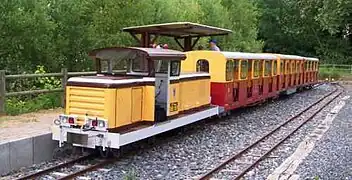 View of the Anse Plage tourist railway station with a train in the station