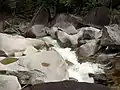 Water rushing between boulders from the Devil's Pool