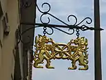 The pretzel has been in use as an emblem of bakers, here with two lions, in Görlitz, Germany.