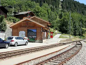 Wooden two-story building next to island platform