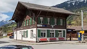 Three-story building with gabled roof