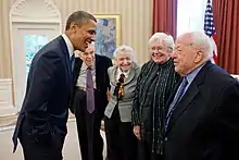 President Barack Obama greets 2010 Fermi Award recipients Dr. Mildred S. Dresselhaus and Dr. Burton Richter in the Oval Office, May 7, 2012