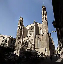 stone gothic facade with rose window and two towers