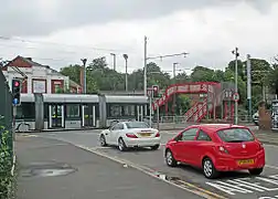 Traffic waiting for a tram to cross