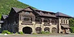 View of the stone and wood Bear Mountain Inn after renovations.