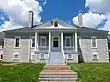 stately-looking large house of gray brick