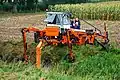 Three wheeled slope mower