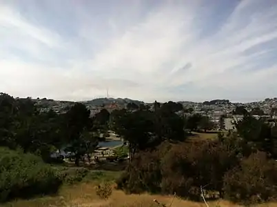 View down to McNab Lake and Louis Sutter Playground, with Sutro Tower in the background.