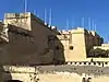 Short stretch of stepped curtain wall leading down to Birgu Creek