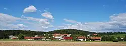 View of Bistrica from the rail line from Sevnica to Trebnje south of the village