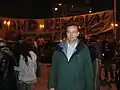 Man stood in front of banner