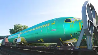 Boeing 737 Next Generation fuselage being transported by rail on a flatcar