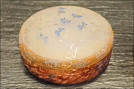 Daum candy container with cornflower design of engraved glass, enamel, and gold (1901)