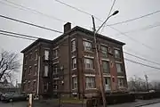 Apartment house on Milne Street, in Sterling Hill, settled by the Irish. Three deckers, brick tenerments and small houses are found here.