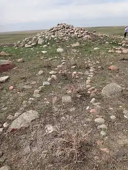 The center stone cairn with a Napi effigy in the foreground