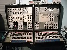 One of the first commercially available analog sequencers (bottom, 3×8-step and 3×16-step) on Buchla 100 (1964/1966)