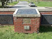 Metal tablets on a brick wall