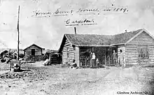 a log cabin on the plains of cardston alberta canada