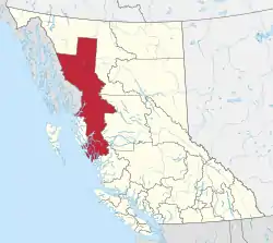 A map of British Columbia depicting its 29 regional districts and equivalent municipalities. One is highlighted in red.