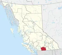 A map of British Columbia depicting its 29 regional districts and equivalent municipalities. One is highlighted in red.