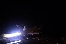 US Navy F/A-18 taking off prior to the airstrikes