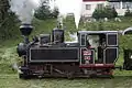 Mocănița narrow-gauge steam train (model CFI 764-243) at the former forest railway station at Comandău