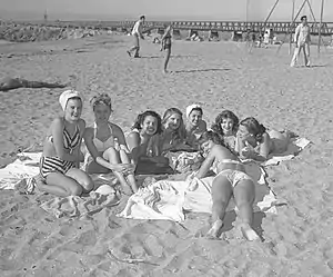 Cabrillo Beach (1947): beachgoers and breakwater jetty in background to historic Angels Gate Lighthouse