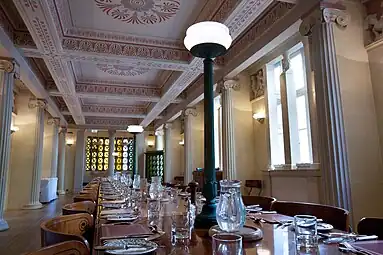 New Classical Ionic columns in the Gonville and Caius College Hall, Cambridge, UK, inspired by those from the Temple of Apollo at Bassaem by John Simpson, 1998