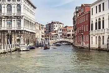 View of a bridge over a canal with buildings on both sides