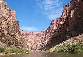 View of a steep-sided canyon from river level