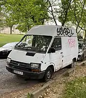 An old Renault Trafic van with various makeshift repairs.