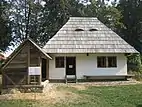 Traditional Romanian house from Vicovu de Jos at the Bukovina Village Museum in Suceava (also with eyes on its roof)