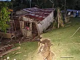 Destroyed home in Catigbian and ground rupture