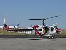 CAL FIRE "Super Huey", formerly an UH-1H, assigned to the Bieber Helitack crew, takes off from the Mojave Airport