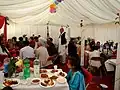 Families and friends are usually seated in a large hall during the ceremony