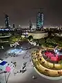 Center of Green Island with booths, games, and restaurants.