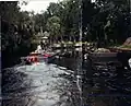 Local boys being pulled behind a well boat near "Baldies"