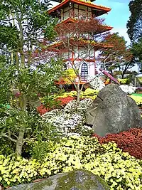 A pagoda covered in chrysanthemums