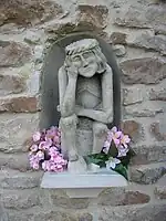 "Pensive Christ" (Chrystus Frasobliwy) at St Sigismund's Church, Szydlowiec, Poland