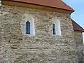 Windows on S of nave showing alterations and evidence for an earlier window.