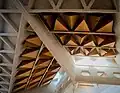 Concrete structures and acoustic baffles in roof of nave