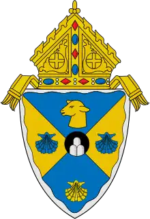 The arms of the Diocese of Rockville Centre: The mounds in the circle at the center of the arms are a play on the name of city in which the diocese is based, Rockville Centre, New York.