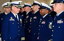 Members of the United States Coast Guard in Full Dress Blue during a change of command ceremony at Coast Guard Base Kodiak.