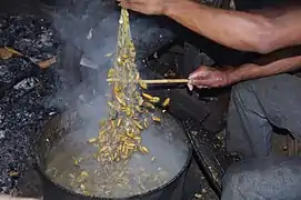 Boiling the soherina (pupae)