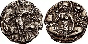 Possible coinage of Meghavahana. Obverse: Shiva Pashupati ("Lord of the Beasts"), making a mudra gesture with right hand and holding filleted trident; behind, a lioness or tiger. Trace of legend Meghana... in Brahmi. Reverse: Goddess seated facing on lotus, holding lotus in both hand, Kidara monogram to left, Jaya in Brahmi to right. Circa 7th century CE, Kashmir.