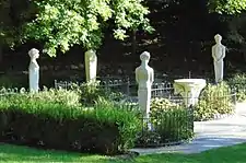 The Palladian Circle, featuring statues of satyrs and Maenads around a sundial, is part of the Italian Gardens