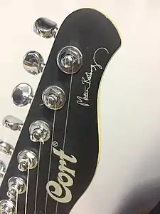 Headstock in front with signature