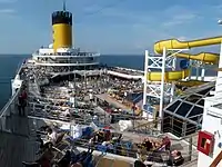 Pool deck space and water slide on Costa Magica